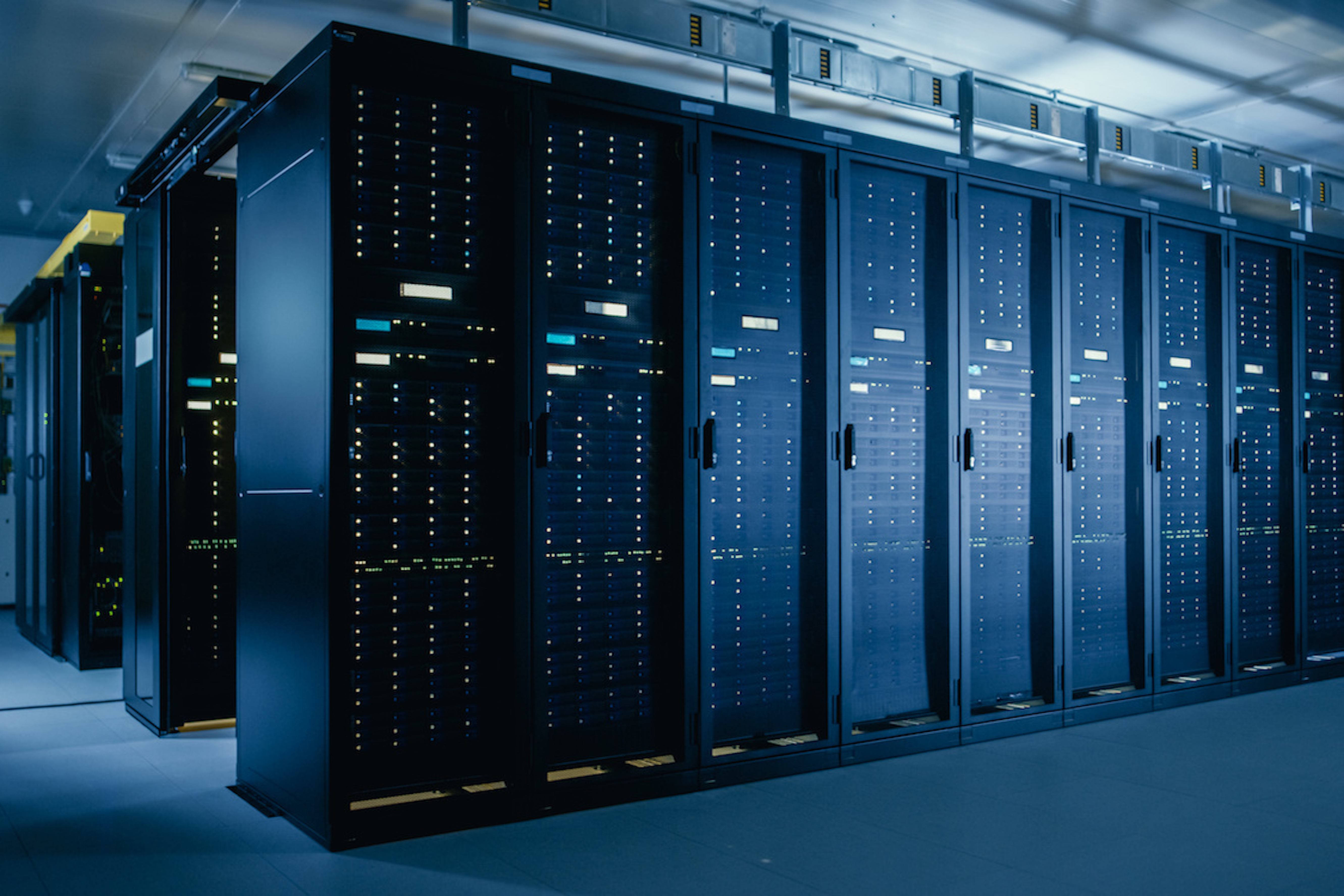 Picture of blue room filled with servers and blinking lights